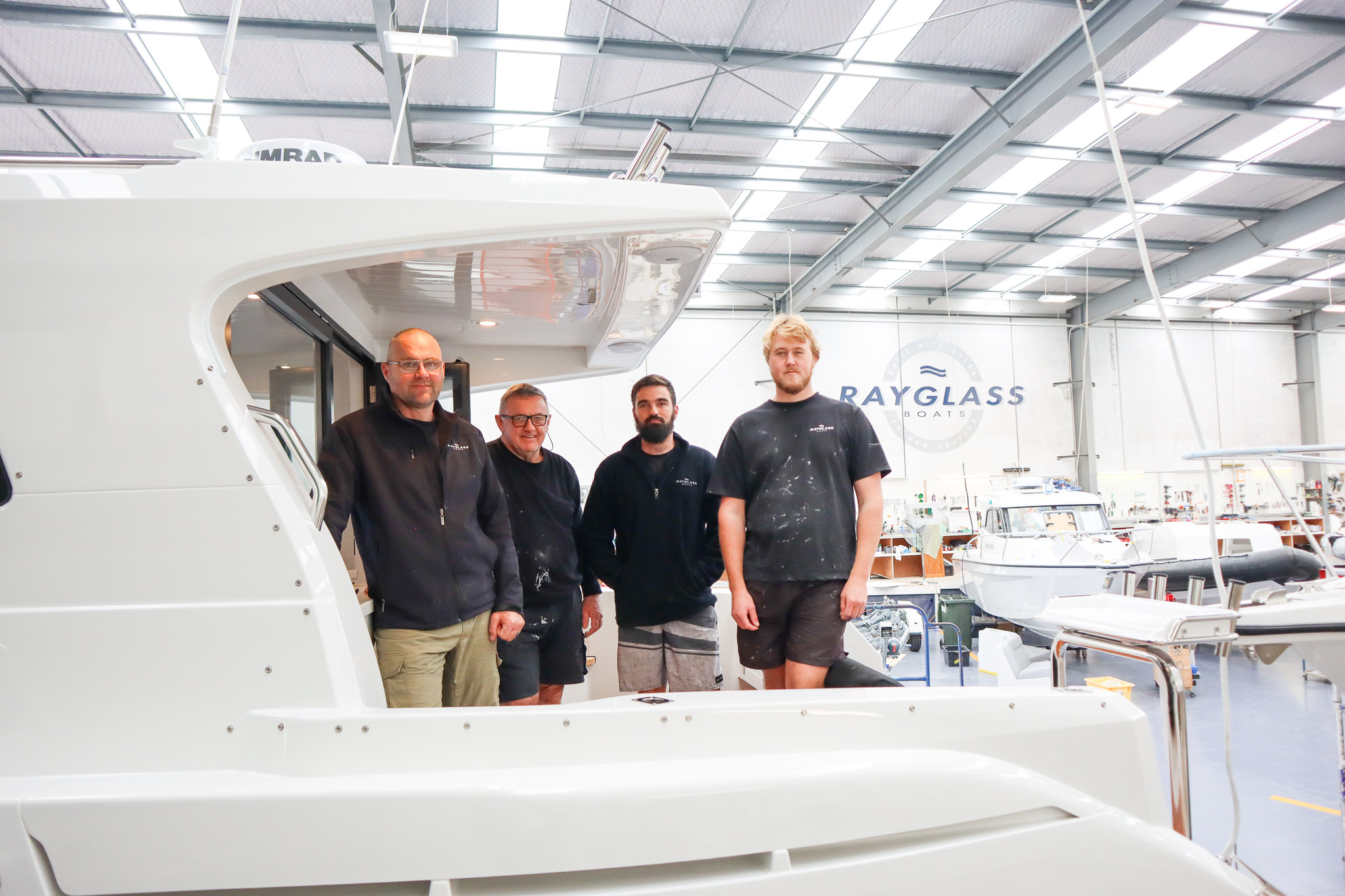 The Rayglass build team on board their creation at our Auckland factory.